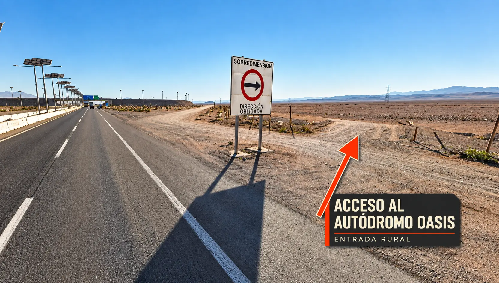 Entrada rural al Autódromo Oasis junto a Ruta 5: una flecha naranja señala el acceso de tierra a la derecha de la carretera, junto a la señal de dirección obligada.